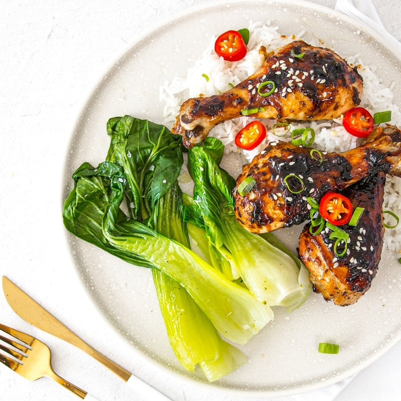Honey Soy Chicken Drumsticks with Asian Greens, featured in the Joy Wholefoods online store.