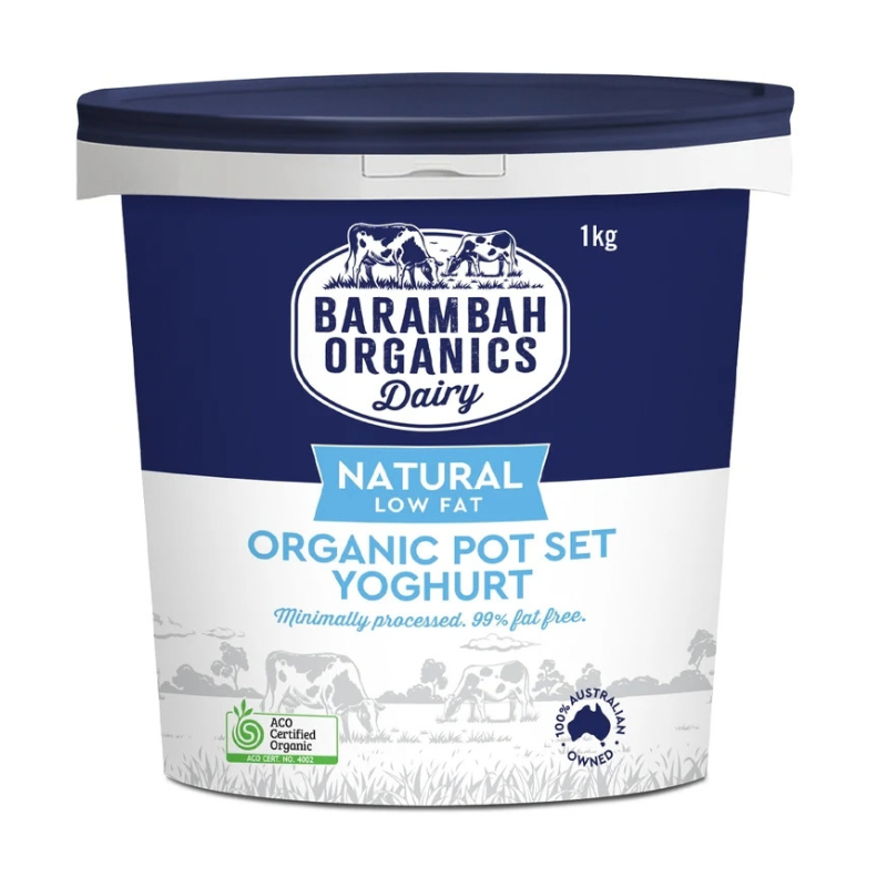A 1kg tub of Barambah Organics Dairy Organic Pot Set Yoghurt, featuring a navy blue and white label with cow illustrations and a dark navy lid, on a plain white background.