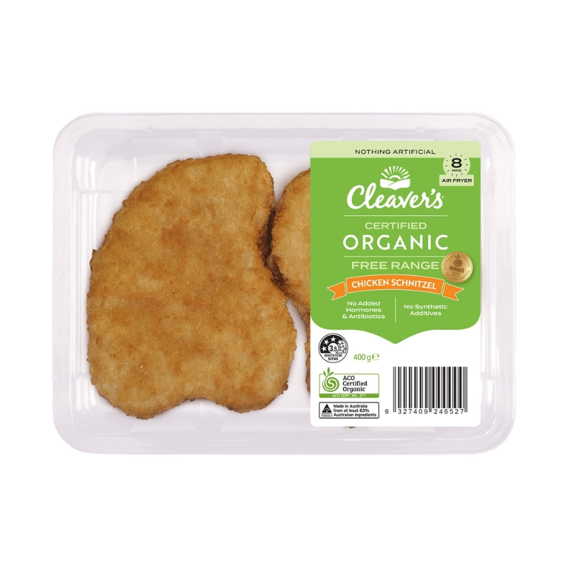 Cleaver's Certified Organic Free Range Chicken Schnitzel in a clear plastic tray with a green and white label, containing two golden-brown breaded cutlets on a white background.