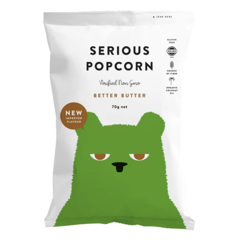A 70g bag of Serious Popcorn 'Better Butter' verified non-gmo and organic corn flour, featuring a white bag with a green cartoon bear face and black text.