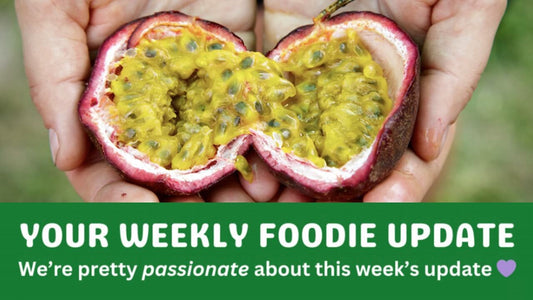 Fresh passionfruit cut open and held in hands, showing vibrant pulp and seeds, representing organic fruit delivery in Brisbane