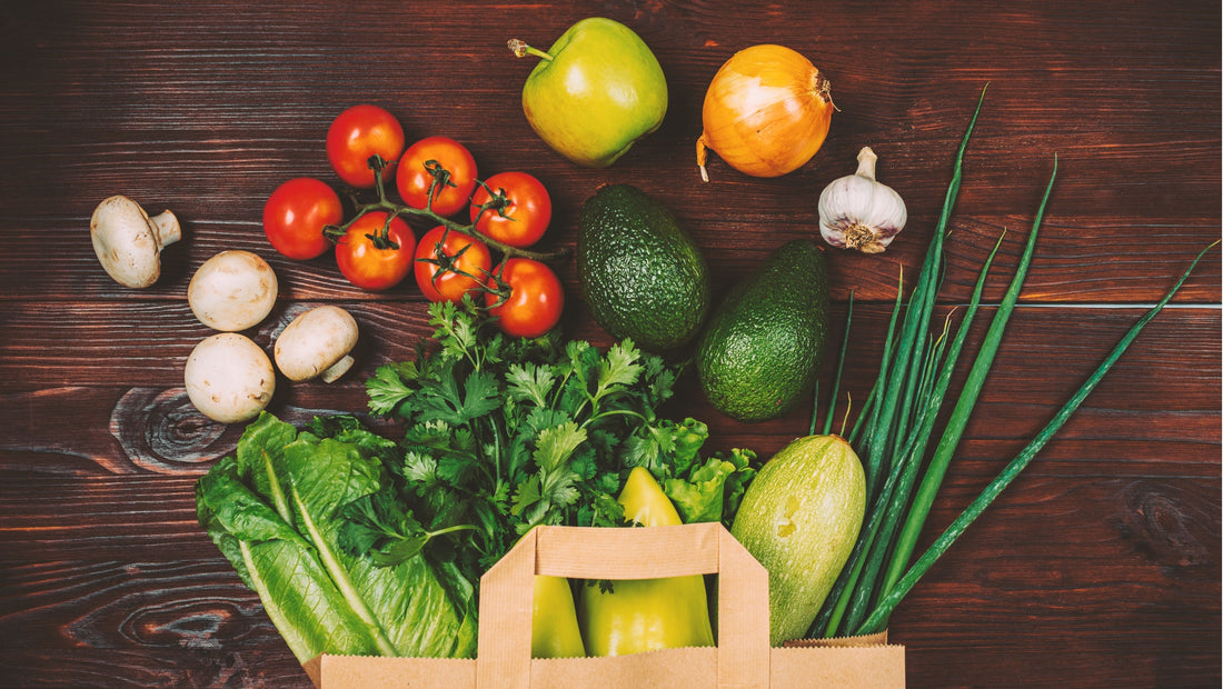 Fresh seasonal vegetables and wholefoods in a reusable grocery bag