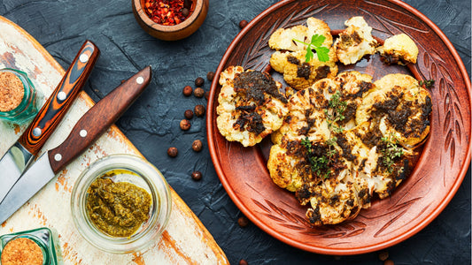 Roasted cauliflower steaks topped with herb dressing