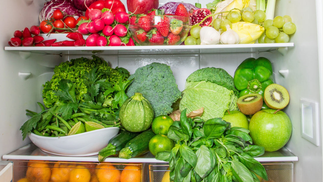 Fruits and vegetables stocked inside a fridge