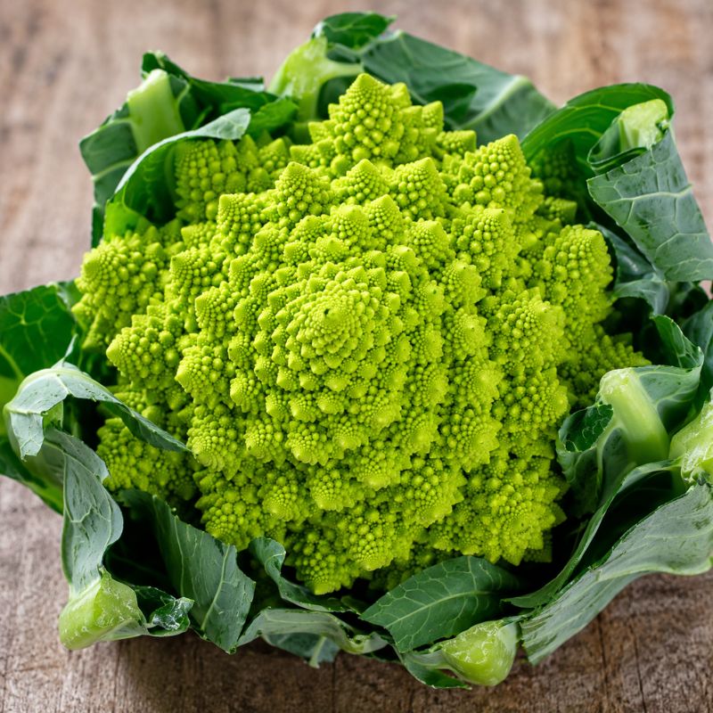 Romanesco cauliflower on wooden bench certified organic