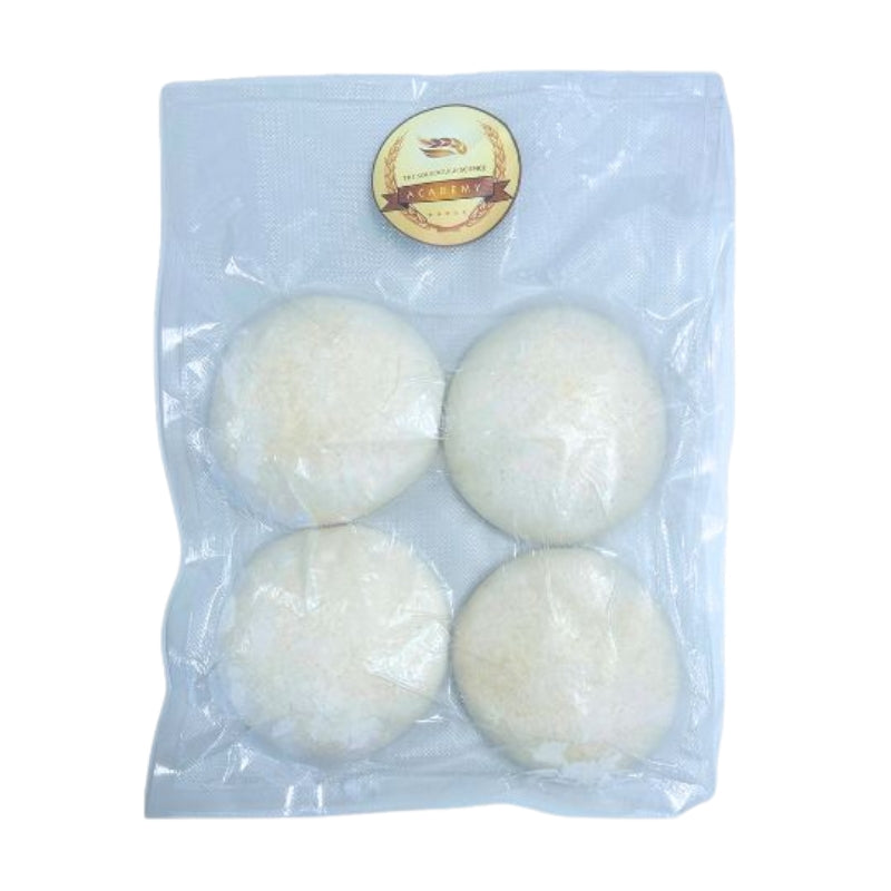 Four round, off-white dough balls sealed in a clear plastic vacuum bag with a round gold and brown label at the top, shown on a plain white background.