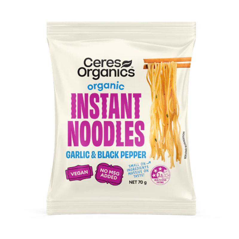 A 70g package of Ceres Organics Organic Instant Noodles garlic & black pepper flavour, featuring a white pouch with green and orange text and a graphic of the noodles.