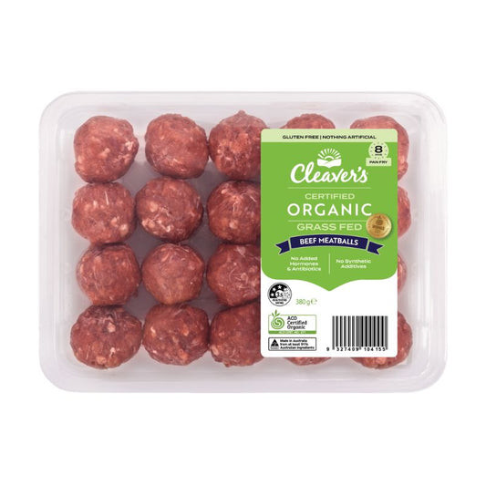 A clear plastic tray of Cleaver's Certified Organic Grass Fed Beef Meatballs with a green and white product label, set against a plain white background.