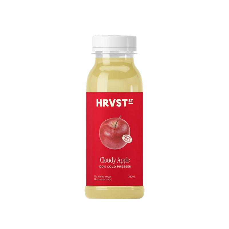 Bottle of HRVST cloudy apple juice on a white background