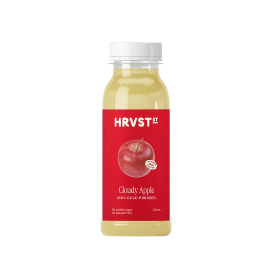 Bottle of HRVST cloudy apple juice on a white background
