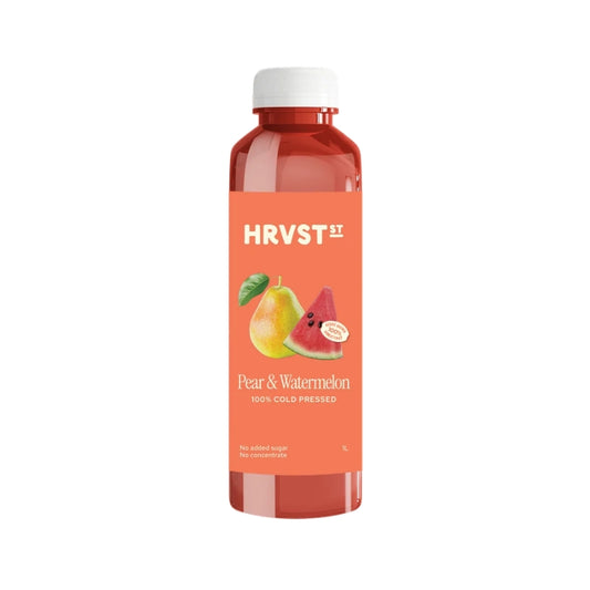A bottle of HRVST HRV Pear & Watermelon cold-pressed juice, featuring a white cap and a peach-colored label with illustrations of a pear and a watermelon slice, set against a plain white background.