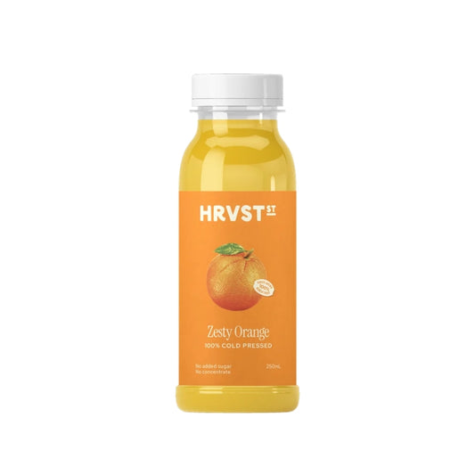 A bottle of HRVST Zesty Orange juice with a white cap and an orange label, shown on a plain white background.