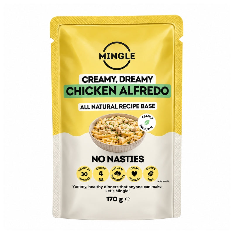 A stand-up pouch of Mingle Creamy, Dreamy Chicken Alfredo recipe base, 170 g. The packaging features a yellow top half and a cream-colored bottom half, with a photo of the prepared pasta dish on the front.