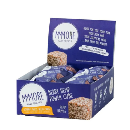 A display box of MMORE Raw Treats Berry Hemp Power Cube snack bars, showing multiple individually wrapped bars inside a blue cardboard and plastic container with product branding and an image of a single square bar.