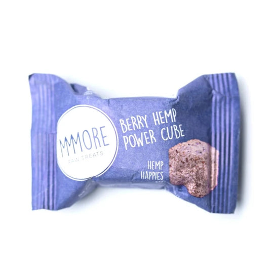 A single MMORE pet treat cube in its wrapper, labeled 'Berry Hemp Power Cube' and 'Hemp Happyies', on a plain white background.