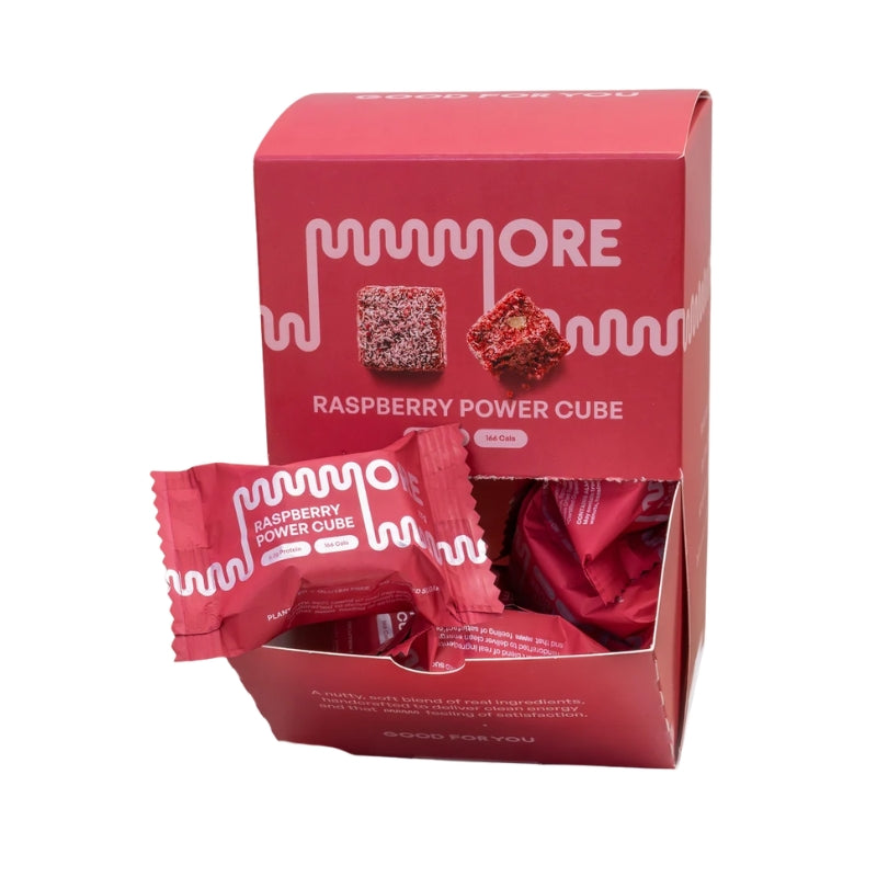 A red box of MORE Raspberry Power Cube protein powder with several individually wrapped cubes displayed in front on a white background.