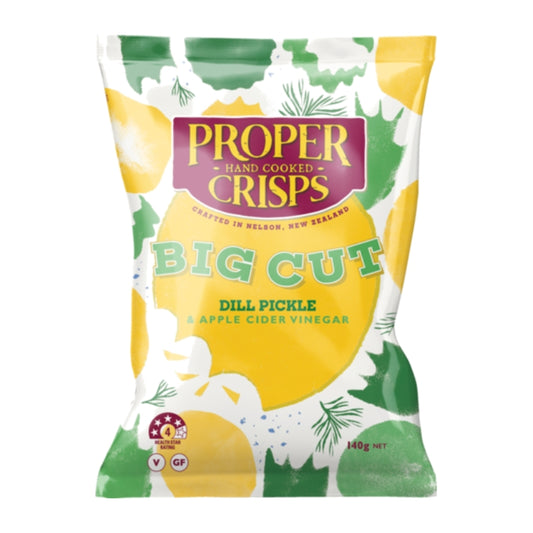 A 140g bag of Proper Hand Cooked Crisps Big Cut Dill Pickle & Apple Cider Vinegar crisps, featuring a colorful design with yellow, green, and white illustrations of lemons and dill, and a purple brand logo.