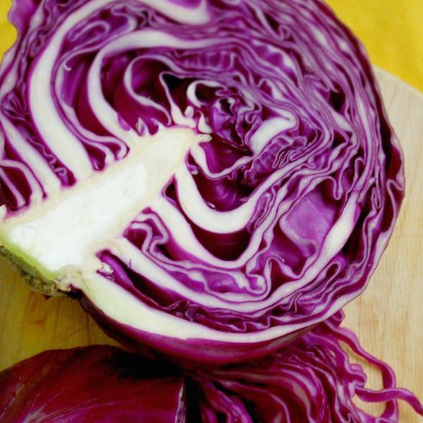 Red cabbage half organic vegetable Brisbane, featured in the Joy Wholefoods online store.
