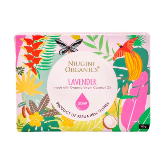 A rectangular box of Niugini Organics Lavender soap, featuring a colorful tropical design with leaves, a butterfly, a bird, and a coconut on a white background.