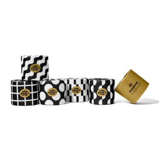 Five rolls of toilet paper with black and white patterns (wavy lines, polka dots, stripes, and checkered squares) and one gold roll, all featuring a gold circular label with the brand name 'Lula's Luxury Paps'.